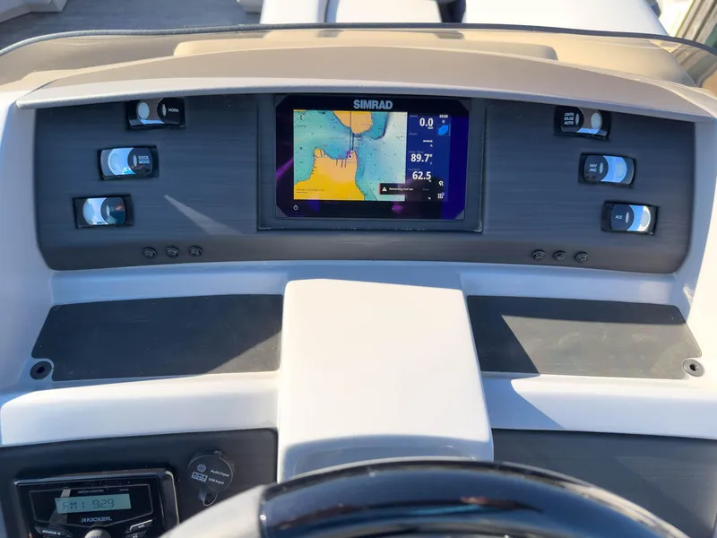 Slide: The Image of Dashboard of a 2024 Bennington 22 LSB boat with Simrad navigation display. - 39