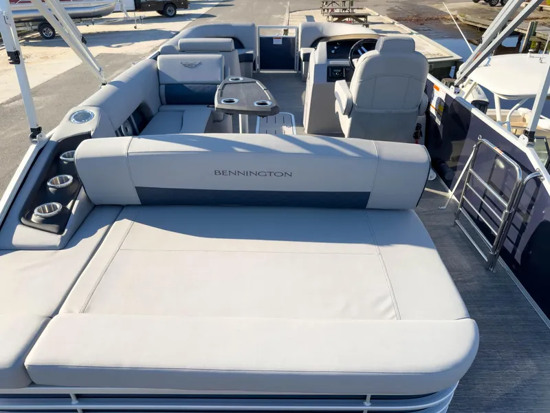 Slide: The Image of 2024 Bennington 22 LSB pontoon boat interior with plush seating and modern design. - 9