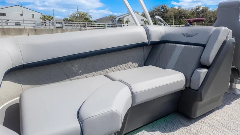 Slide: The Image of 2025 Bennington 22 MFB boat interior with luxurious gray seating and elegant design. - 12