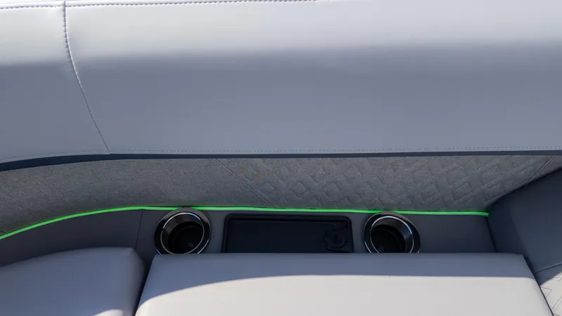 Slide: The Image of 2025 Bennington 22 MFB boat interior with cup holders and sleek design. - 18