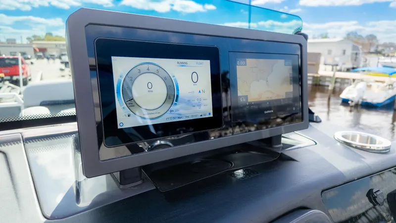 Slide: The Image of Dashboard of 2025 Bennington 22 MFB boat with digital displays and navigation system. - 23