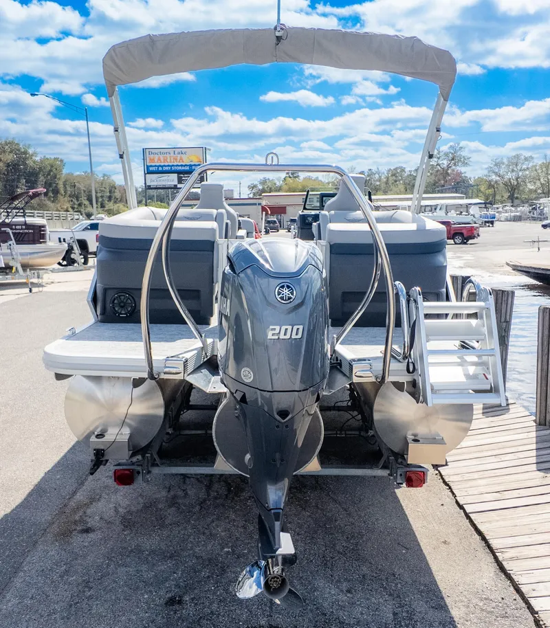 Slide: The Image of 2025 Bennington 22 MFB pontoon boat with Yamaha 200 engine at marina dock. - 7