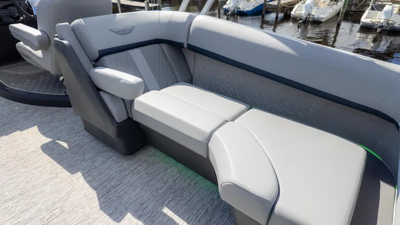 Slide: The Image of Luxurious seating on 2025 Bennington 22 MFB boat, featuring sleek gray upholstery and modern design. - 8