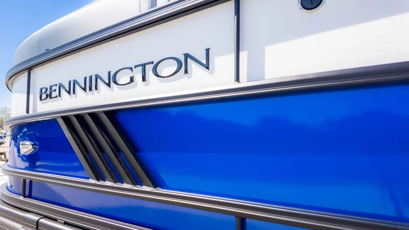 Slide: The Image of 2025 Bennington 22 MSB boat with sleek blue and white design. - 3
