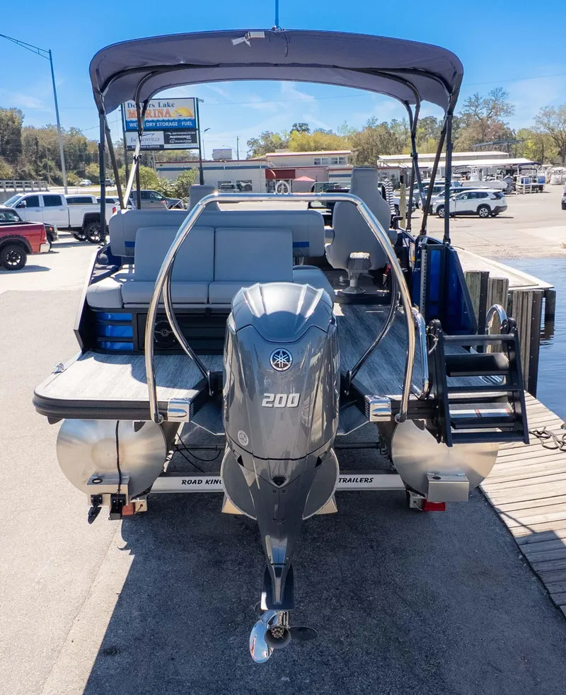 Slide: The Image of 2025 Bennington 22 MSB pontoon boat with Yamaha 200 engine at marina dock. - 5
