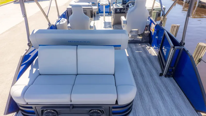 Slide: The Image of 2025 Bennington 22 MSB pontoon boat interior with plush seating and modern design. - 7