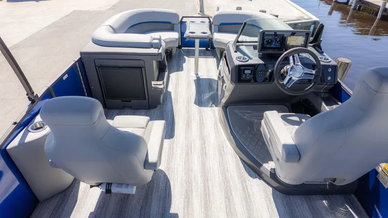 Slide: The Image of 2025 Bennington 22 MSB boat interior with modern seating and steering console. - 8