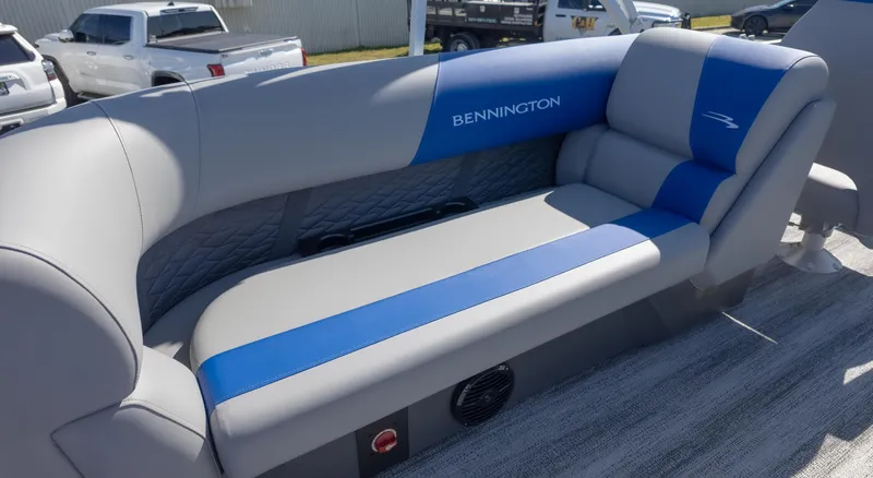Slide: The Image of 2025 Bennington 22 SSR boat seating with blue and gray upholstery. - 11