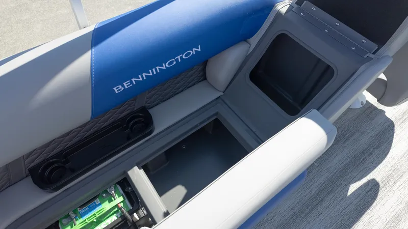 Slide: The Image of 2025 Bennington 22 SSR boat interior with storage compartment and seating. - 12
