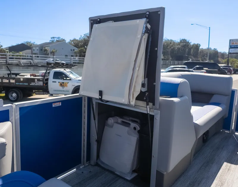 Slide: The Image of 2025 Bennington 22 SSR pontoon boat interior with storage compartment and seating. - 14