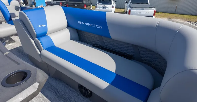 Slide: The Image of 2025 Bennington 22 SSR boat interior with blue and gray seating. - 15