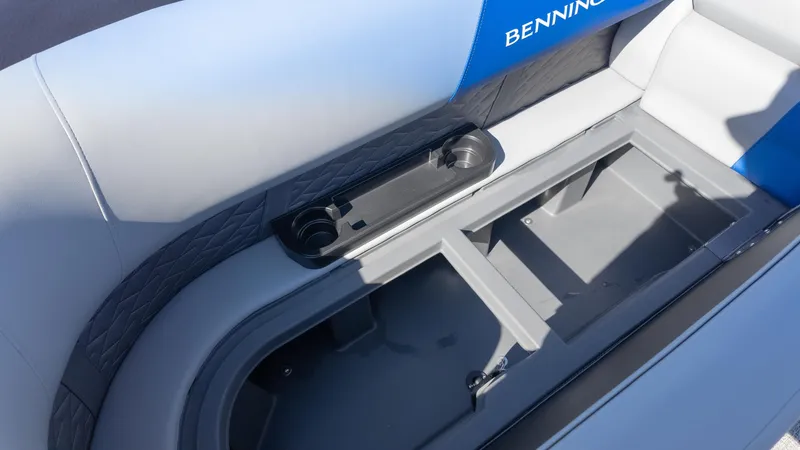 Slide: The Image of 2025 Bennington 22 SSR boat seat with storage compartment and cup holders. - 17