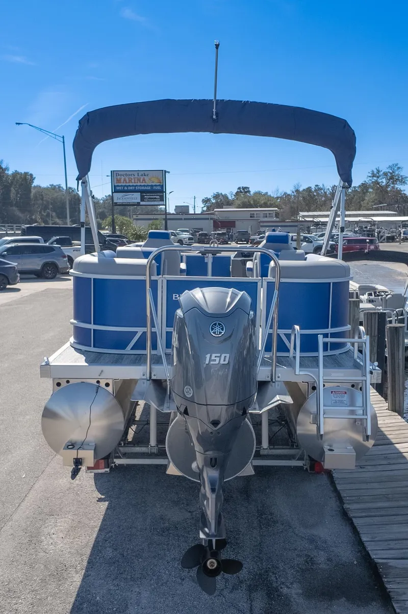 Slide: The Image of 2025 Bennington 22 SSR pontoon boat with Yamaha 150 engine at marina. - 5