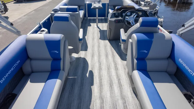 Slide: The Image of 2025 Bennington 22 SSR pontoon boat interior with blue and gray seating. - 9