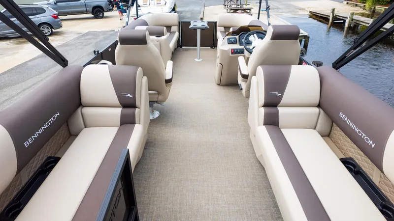 Slide: The Image of 2025 Bennington 22 SSR pontoon boat interior with luxurious seating and modern design. - 7