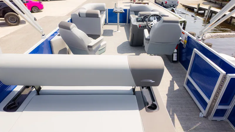 Slide: The Image of 2024 Bennington 22 SVSB pontoon boat interior with seating and steering console. - 10