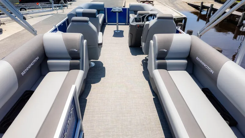 Slide: The Image of 2024 Bennington 22 SVSR pontoon boat interior with plush seating and modern design. - 5