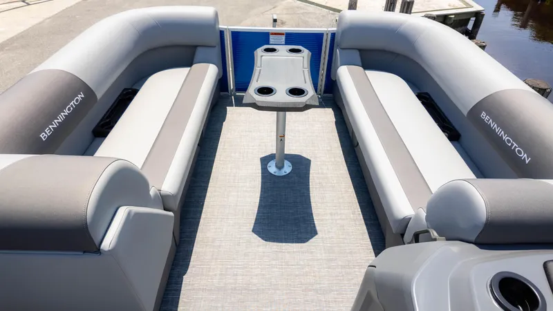 Slide: The Image of 2024 Bennington 22 SVSR pontoon boat interior with gray seating and central table. - 7