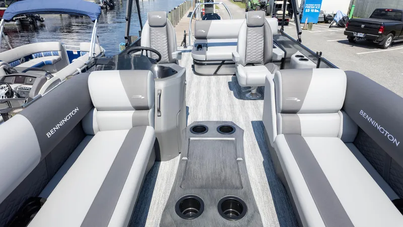 Slide: The Image of 2025 Bennington 23 SSB pontoon boat interior with luxurious seating and modern design. - 11