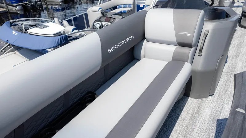 Slide: The Image of 2025 Bennington 23 SSB boat interior with gray seating and sleek design. - 20