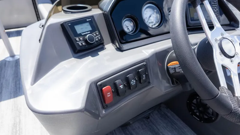 Slide: The Image of Dashboard of 2025 Bennington 23 SSB boat with steering wheel and control panel. - 23