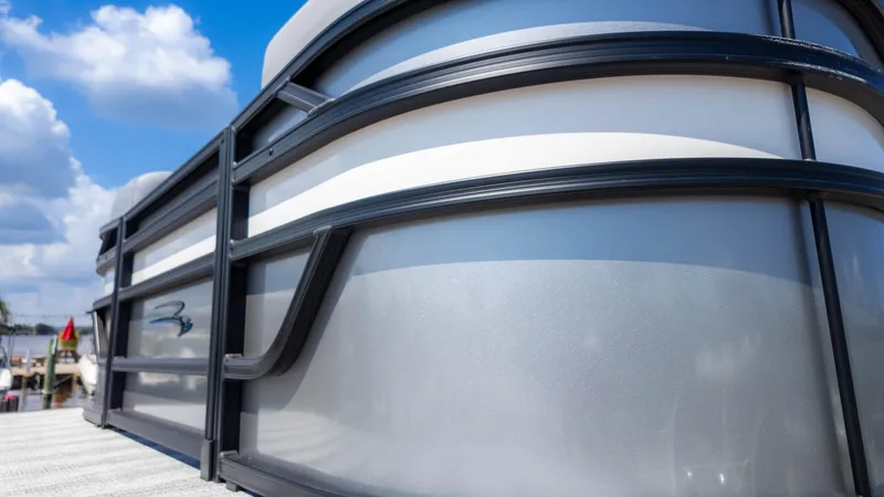 Slide: The Image of 2025 Bennington 23 SSB pontoon boat close-up with sleek design under blue sky. - 7