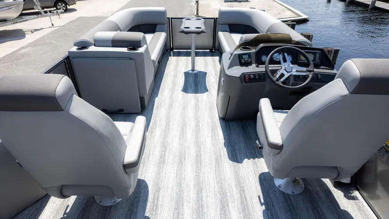 Slide: The Image of 2025 Bennington 23 SSB boat interior with modern seating and steering console. - 9