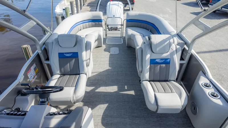 Slide: The Image of 2024 Bennington 24 LXSFBA pontoon boat interior with plush seating and modern design. - 13