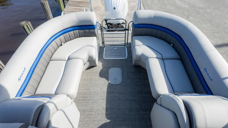 Slide: The Image of 2024 Bennington 24 LXSFBA pontoon boat interior with plush seating and modern design. - 14