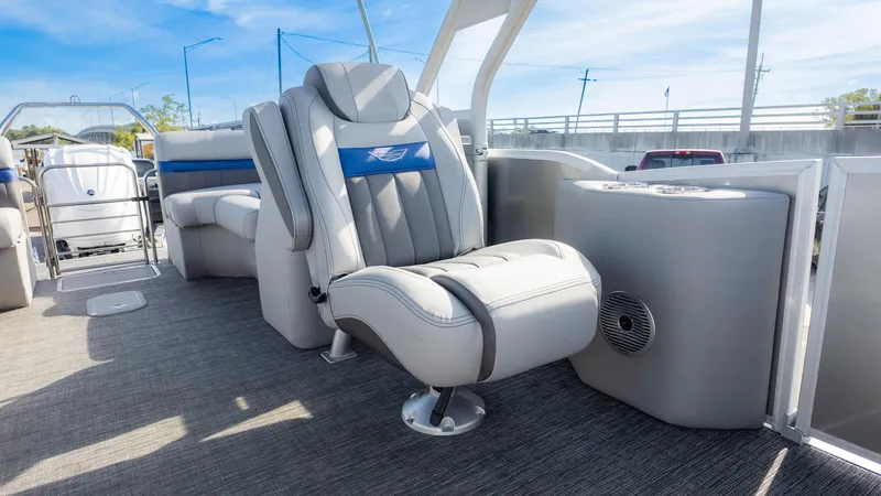 Slide: The Image of 2024 Bennington 24 LXSFBA pontoon boat interior with luxurious seating and modern design. - 18