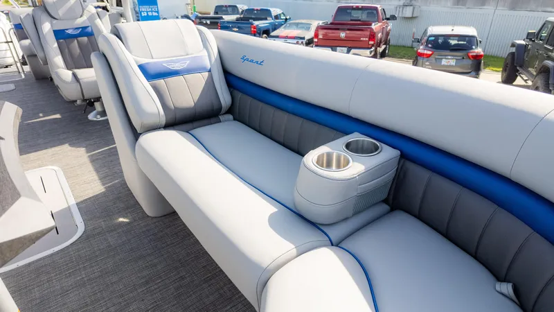 Slide: The Image of 2024 Bennington 24 LXSFBA pontoon boat interior with plush seating and cup holders. - 20
