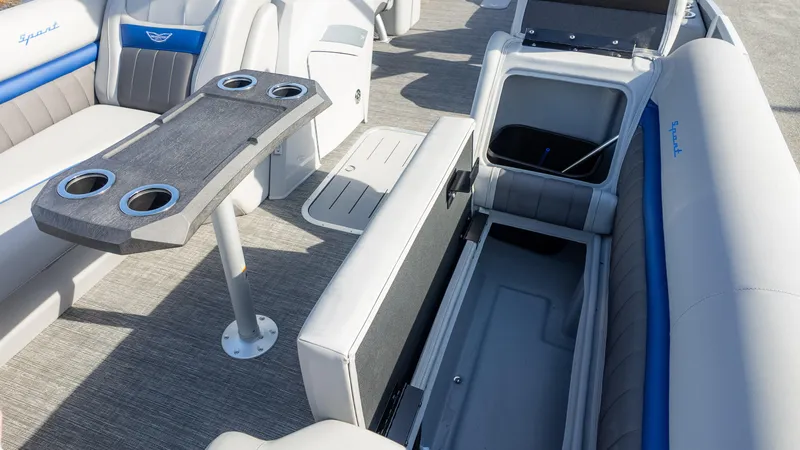 Slide: The Image of 2024 Bennington 24 LXSFBA boat interior with seating, table, and storage compartments. - 21