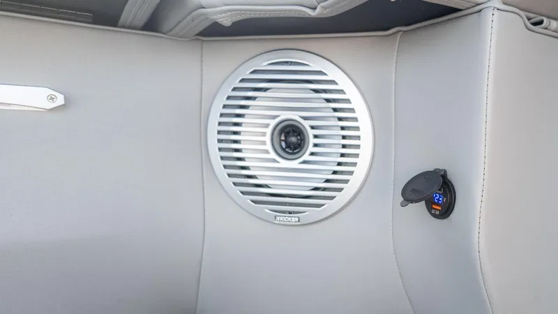 Slide: The Image of 2024 Bennington 24 LXSFBA boat interior with speaker and USB port. - 23