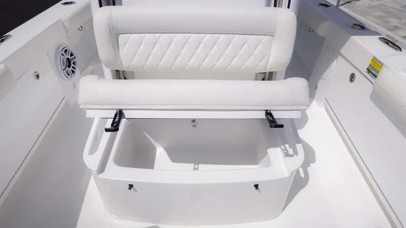 Slide: The Image of 2025 Everglades 253CC boat seat with storage compartment, white upholstery. - 11