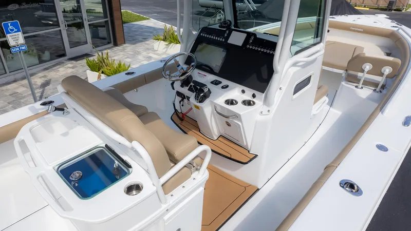 Slide: The Image of 2025 Everglades 273CC boat interior with modern helm and seating. - 13