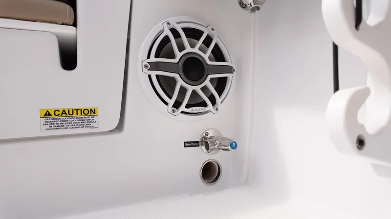 Slide: The Image of Speaker and water outlet on 2025 Everglades 273CC boat interior. - 16