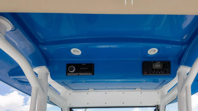 Slide: The Image of Blue interior roof of 2025 Everglades 273CC boat with audio controls. - 22