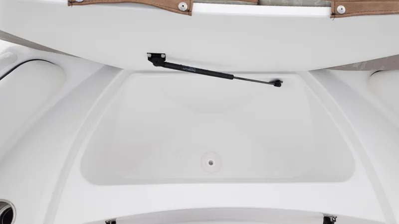 Slide: The Image of Open storage compartment in 2025 Stingray 173CC boat. - 10