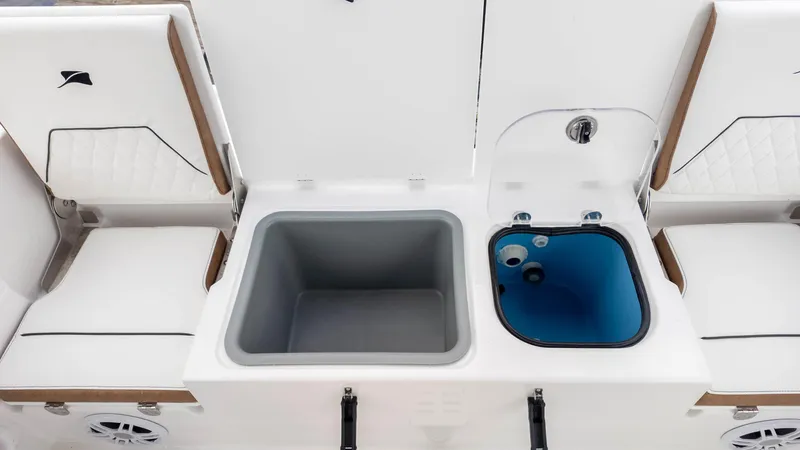 Slide: The Image of 2025 Stingray 173CC boat interior with seating, storage compartments, and a livewell. - 13