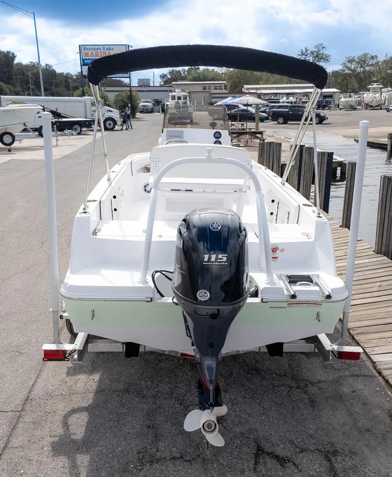 Slide: The Image of 2025 Stingray 173CC boat with Yamaha 115 outboard motor at marina dock. - 5