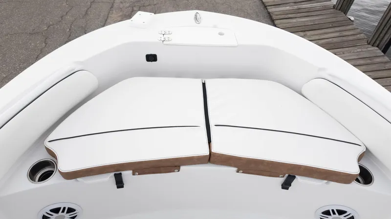 Slide: The Image of 2025 Stingray 173CC boat interior with cushioned seating and cup holders. - 9