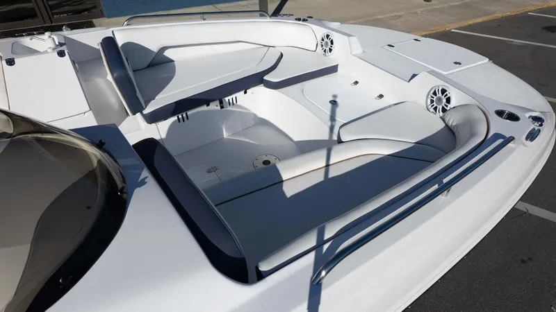 Slide: The Image of 2025 Stingray 192SC boat interior with white seating and modern design. - 10