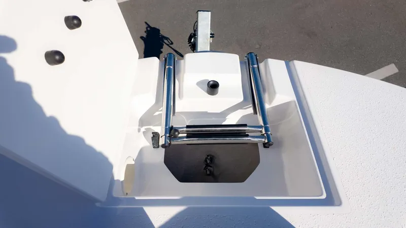 Slide: The Image of 2025 Stingray 192SC boat ladder and anchor compartment, featuring stainless steel hardware. - 21
