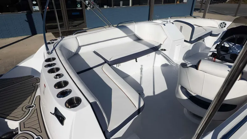 Slide: The Image of 2025 Stingray 192SC boat interior with white seating and modern design. - 9
