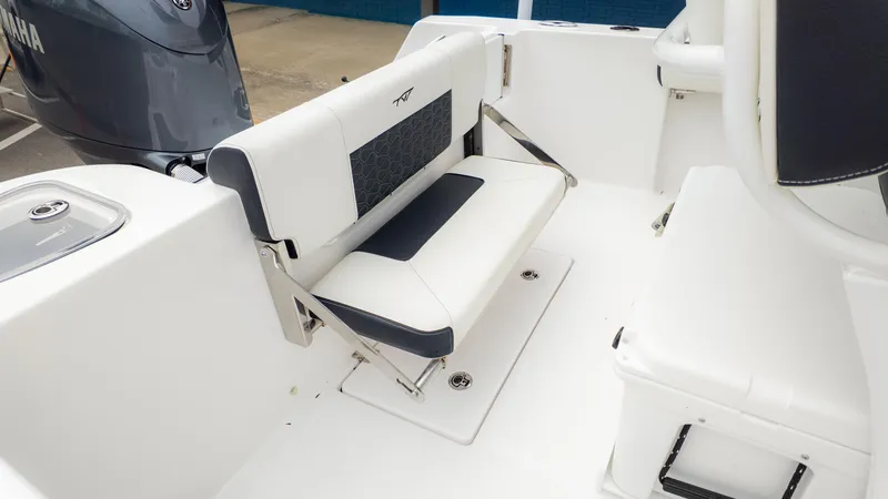 Slide: The Image of 2025 Tidewater 210CC boat interior with foldable seating and Yamaha engine. - 10