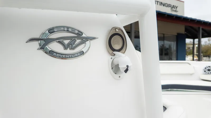 Slide: The Image of 2025 Tidewater 210CC boat emblem and fuel cap detail. - 18
