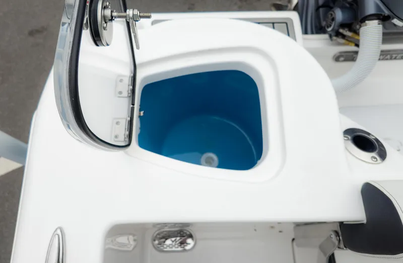 Slide: The Image of Livewell on 2025 Tidewater 210CC boat, featuring a blue interior and sleek design. - 19