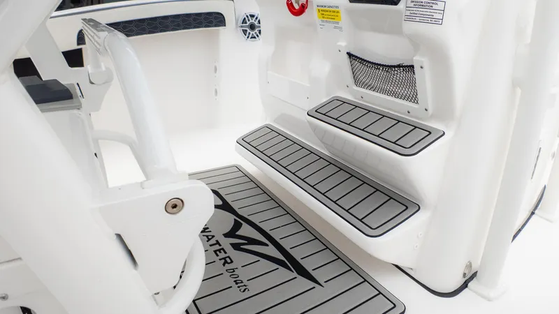 Slide: The Image of 2025 Tidewater 210CC boat interior with non-slip steps and storage net. - 20