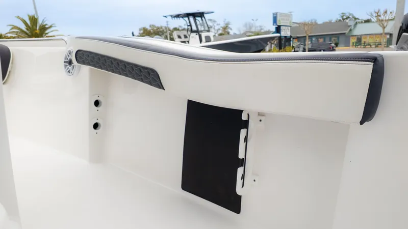 Slide: The Image of 2025 Tidewater 210CC boat interior with cushioned seating and modern design elements. - 21