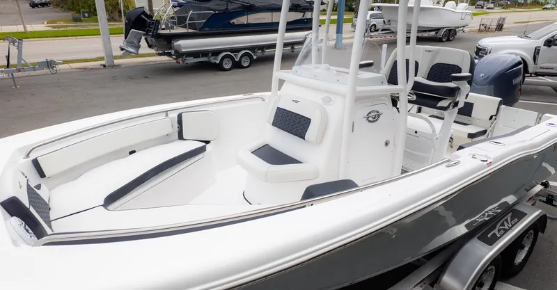 Slide: The Image of 2025 Tidewater 210CC boat with sleek design and comfortable seating on a trailer. - 3
